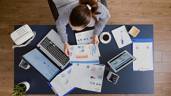 Timely Bookkeeping Service for Australia 7 top view businesswoman sitting desk table checking financial accounting documents 1